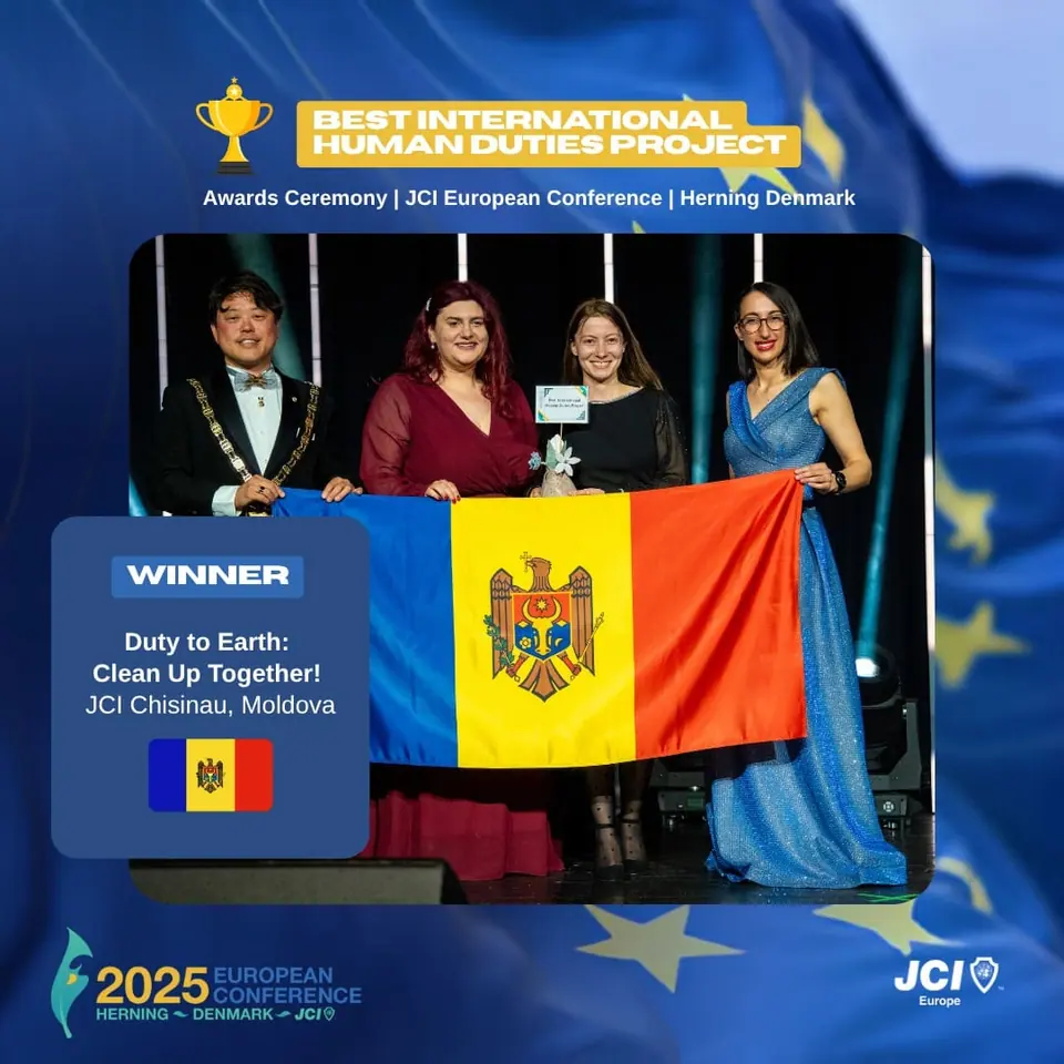 Winners card for Best International Human Duties Project: Duty to Earth: Clean Up Together! by JCI Chisinau, Moldova, on stage with the Moldovan flag