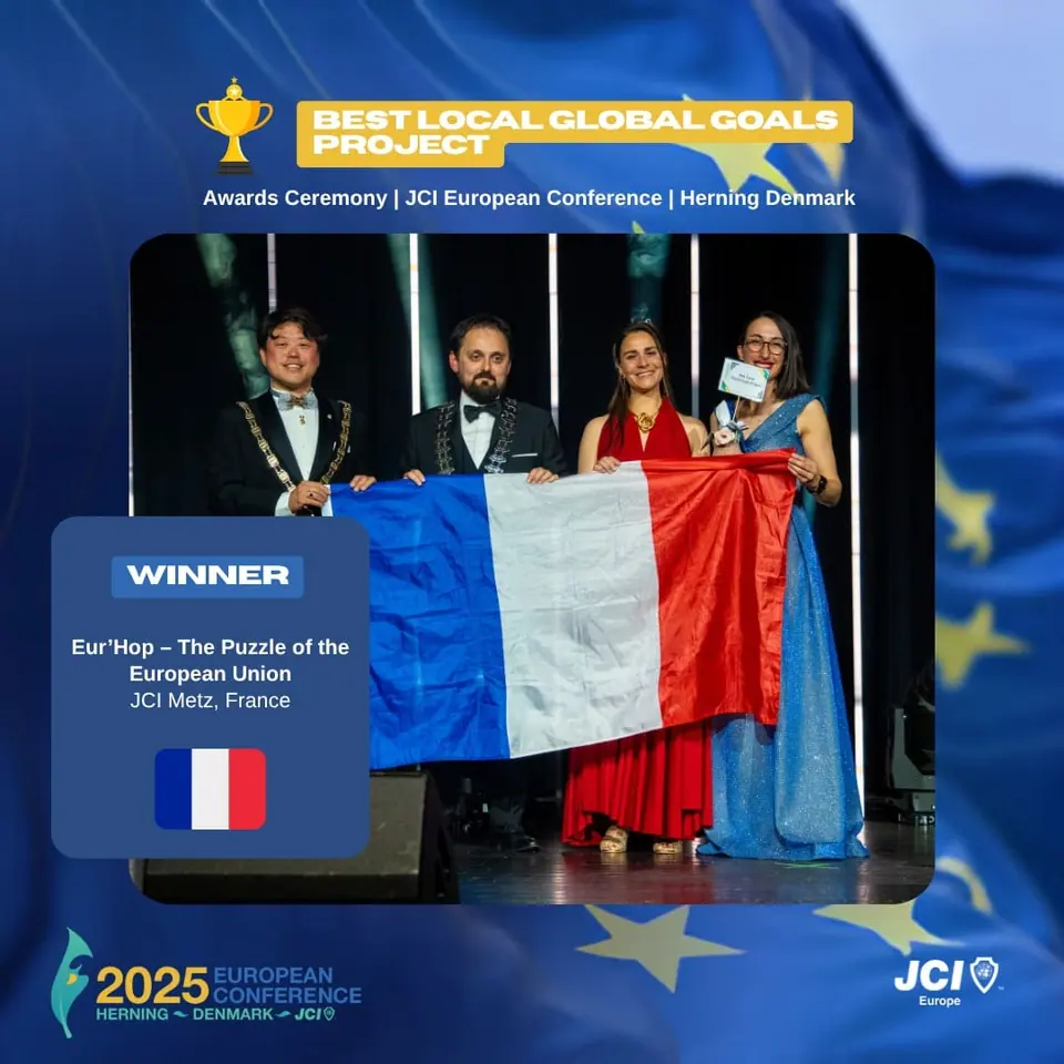 Winners card for Best Local Global Goals Project: Eur'Hop by JCI Metz, France, on stage with the French flag
