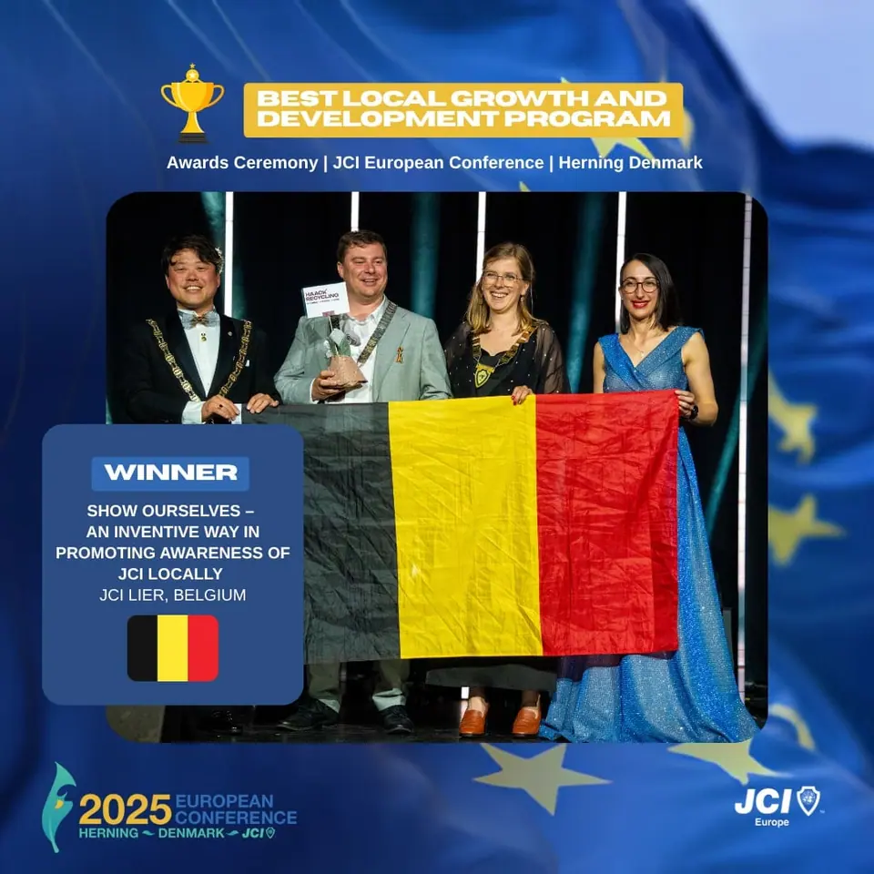 Winners card for Best Local Growth and Development Program: a JCI Lier, Belgium project, on stage with the Belgian flag