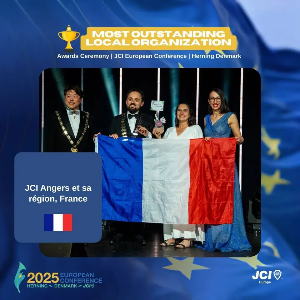 Winners card for Most Outstanding Local Organization: JCI Angers et sa région, France, on stage with the French flag