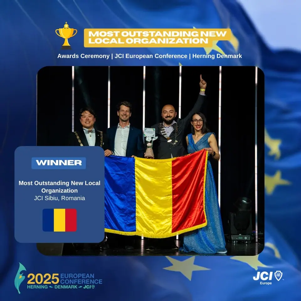 Winners card for Most Outstanding New Local Organization: JCI Sibiu, Romania, on stage with the Romanian flag