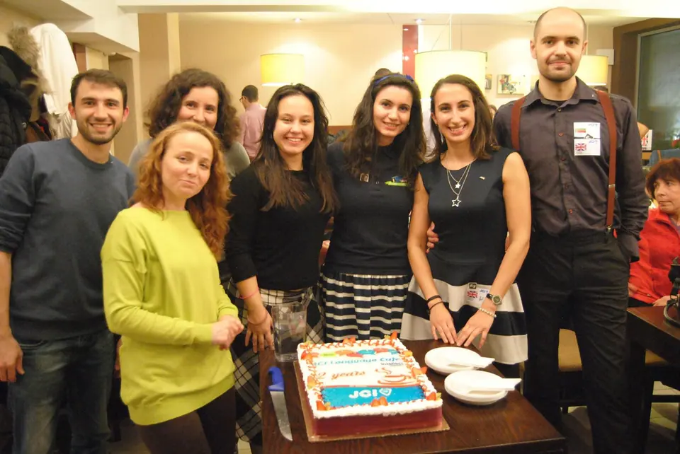 Members gathered around a birthday cake for the second birthday of JCI Language Cafe Sofia