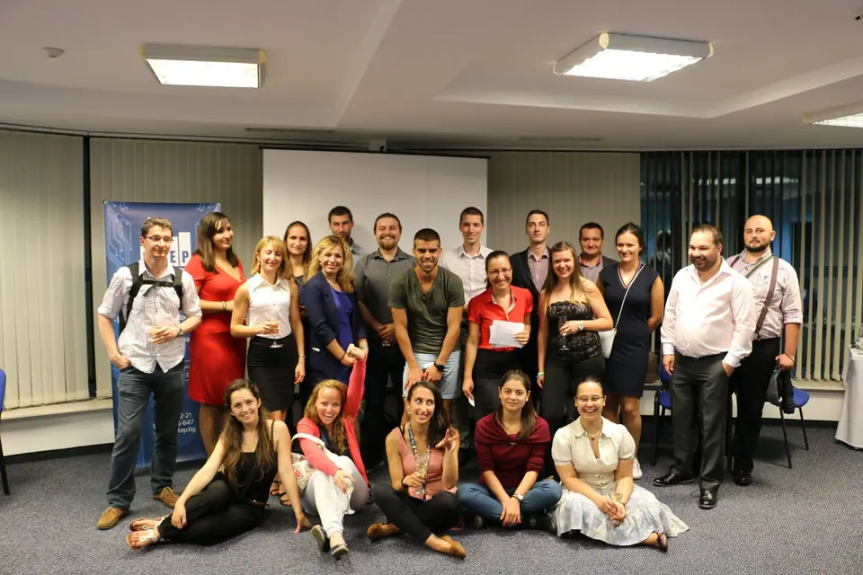 Participants of the Business Meetings on the Roof event posing in a room