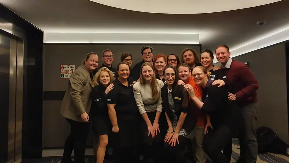 The 2020 JCI Europe team posing together in a dim room