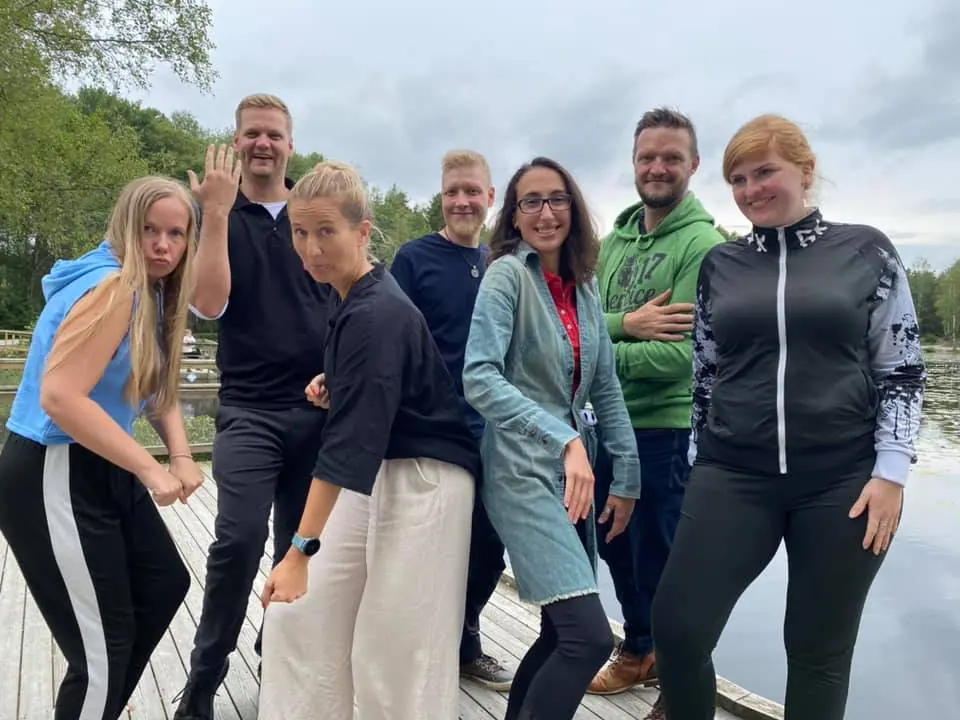 Six participants of the 2021 JCI European Academy posing playfully by a lake