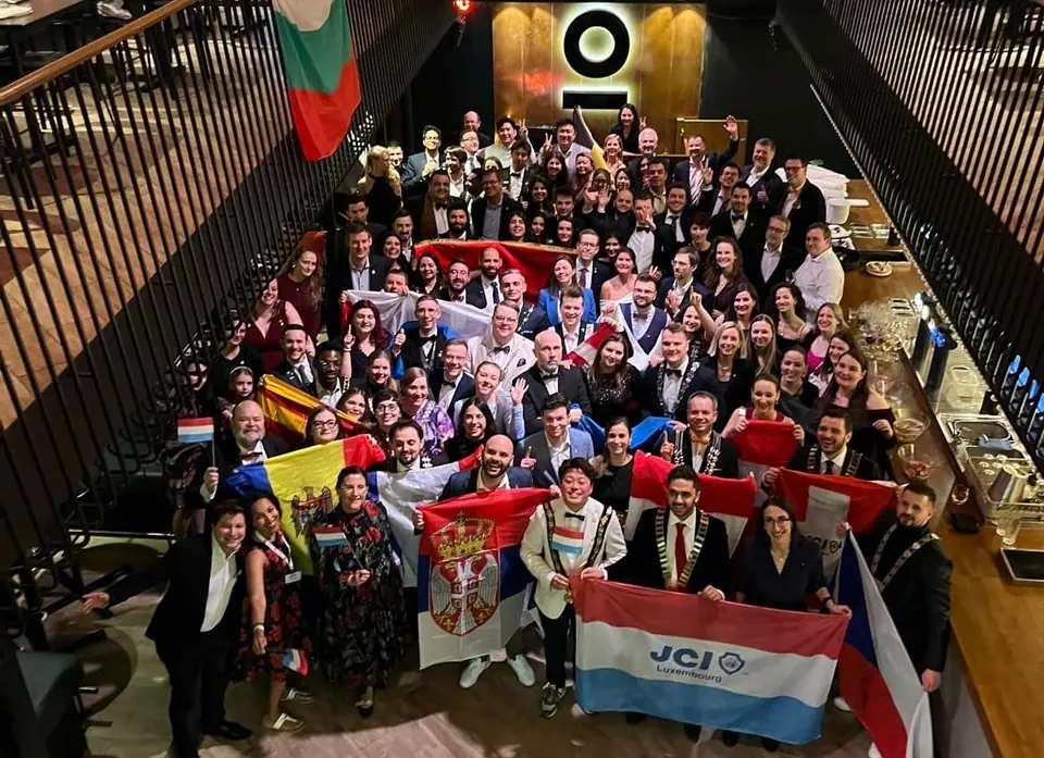 Participants of the 2025 JCI European Presidents Meeting posing with national flags