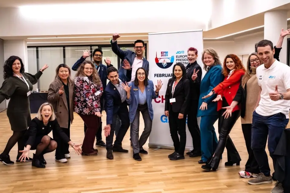 A cheerful group of JCI members posing together at a JCI Europe meeting