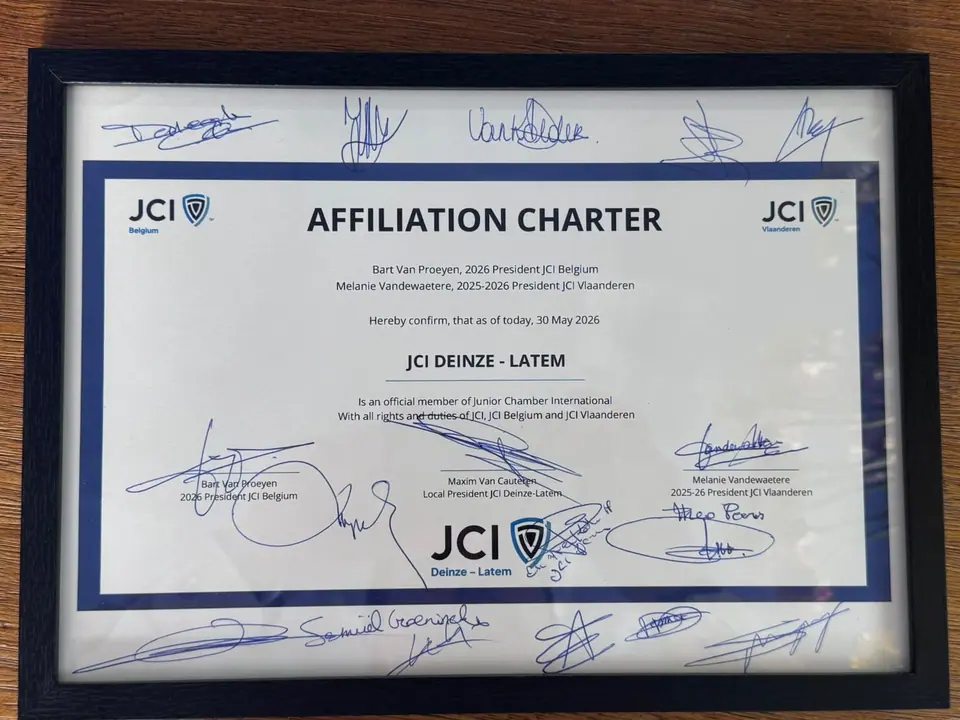 A framed JCI Affiliation Charter for JCI Deinze-Latem, signed by the national presidents